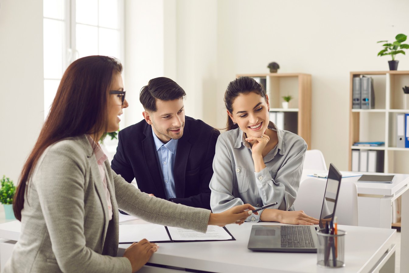 Happy Couple Meeting Professional Real Estate Agent, Bank Manager or Loan Broker